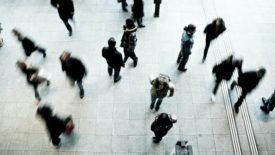 blurred image of people walking